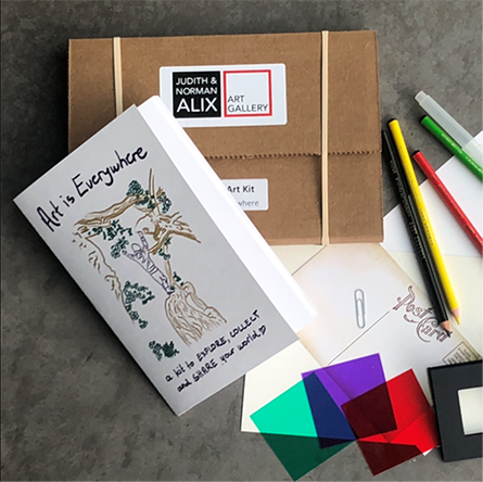 Art is Everywhere Pencil crayons, a brown paper package and a white card with the text that reads Art is Everywhere