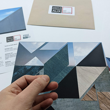 Freestyle Forms A hand holding a collage of triangular paper cutouts