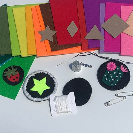 Patchwork Felt of all colours lined up above star and circular shaped patches